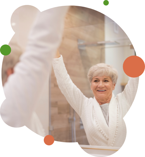 Senior woman stretching in front of mirror