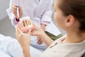 Dentist explaining dental implants to patient
